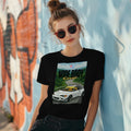 Person wearing a black Tshirt T-shirt Japan Hakone White Hatchback with Fender Flares